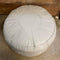 cream leather ottoman