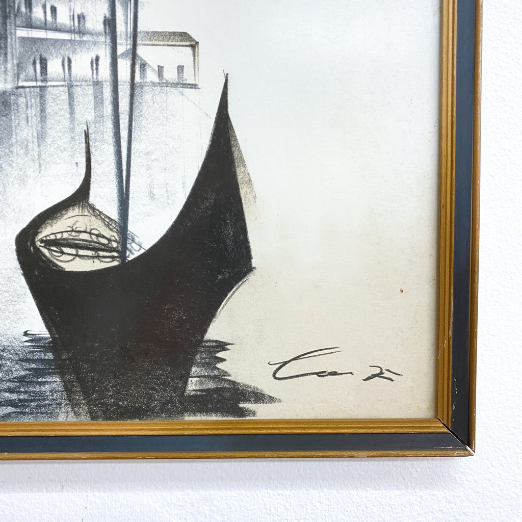 Framed artwork of a gondola with a signature on a white background