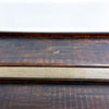 Wooden surface with a dark brown frame on a white background