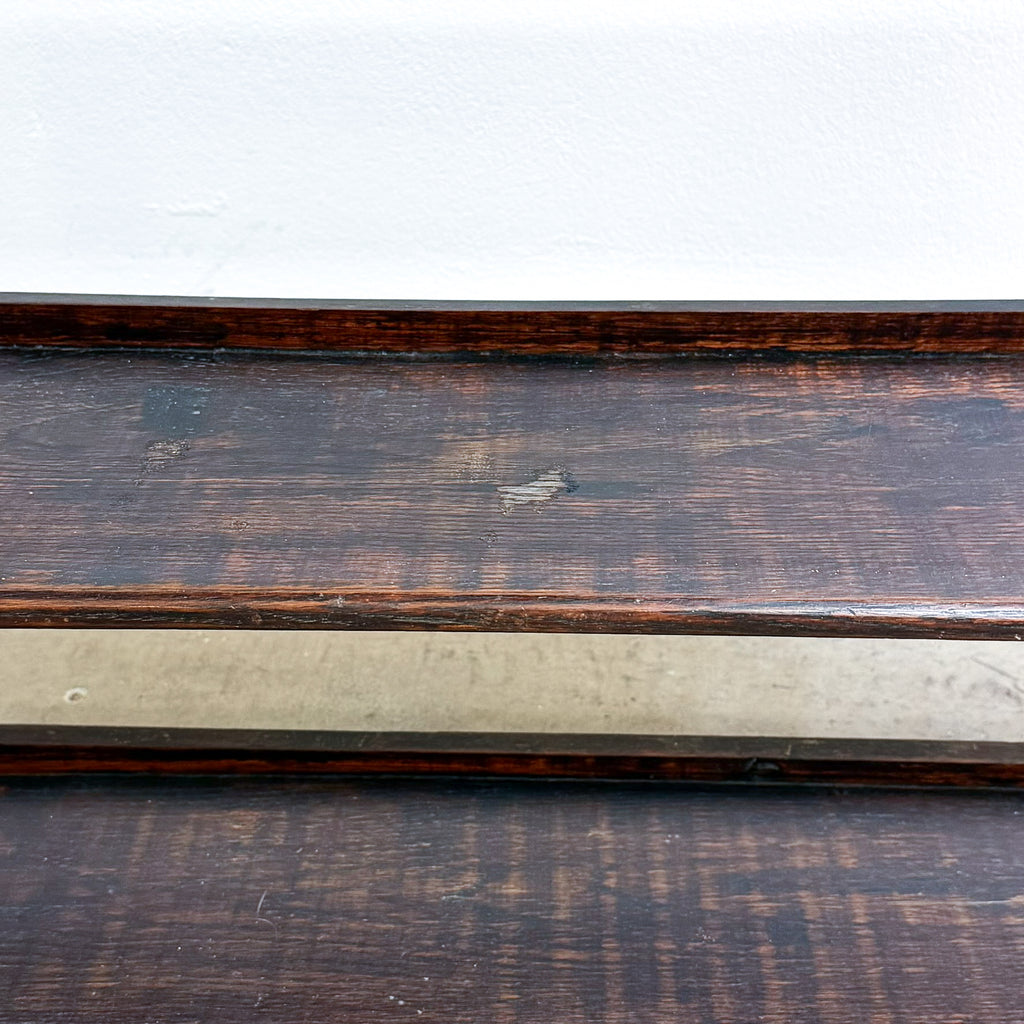 Wooden surface with a dark brown frame on a white background