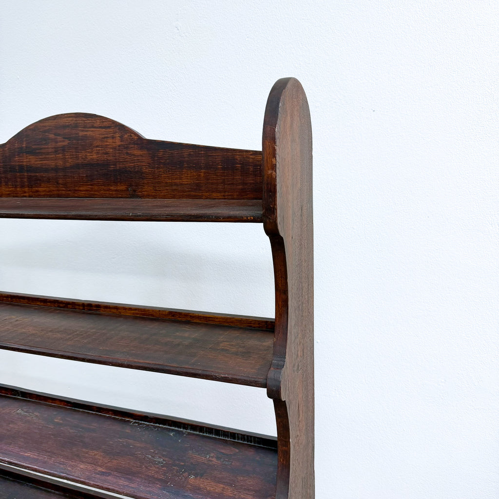 Wooden bench with a curved backrest on a white background