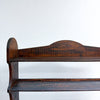 Wooden shelf with a dark brown finish on a white background