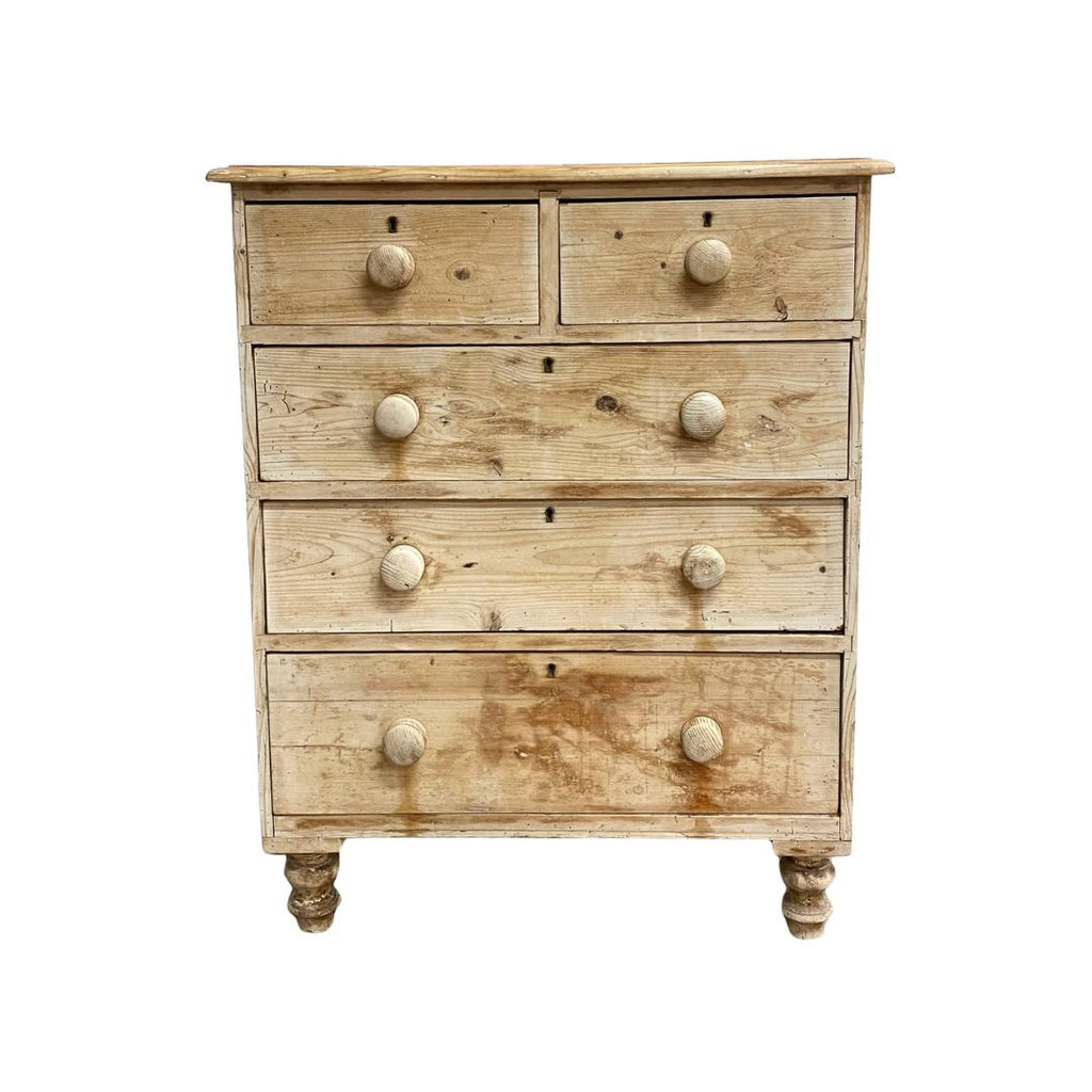 Wooden dresser with five drawers on a white background