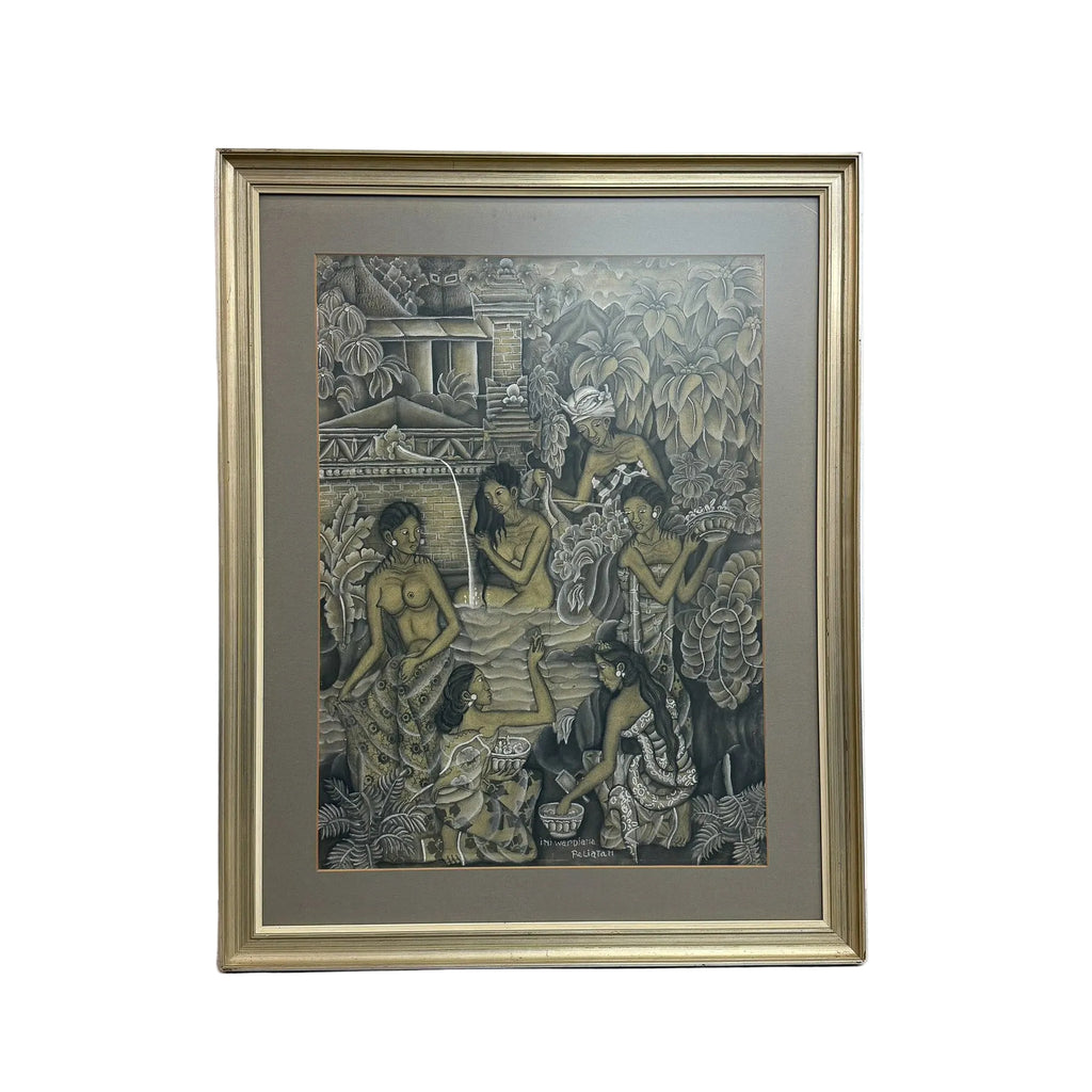 A framed art print featuring a detailed, textured illustration of figures in a natural setting, styled with a wide gray mat and a gold-toned frame, leaning against a white wall on a concrete floor.