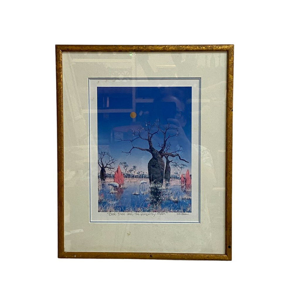 Framed artwork of a landscape with trees and people, on a white background