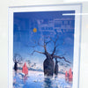 Framed artwork of a tree with a blue sky and yellow sun.