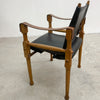 Designed by renowned furniture designer Michael Hirst, this chair drawn inspiration from classic safari aesthetics.