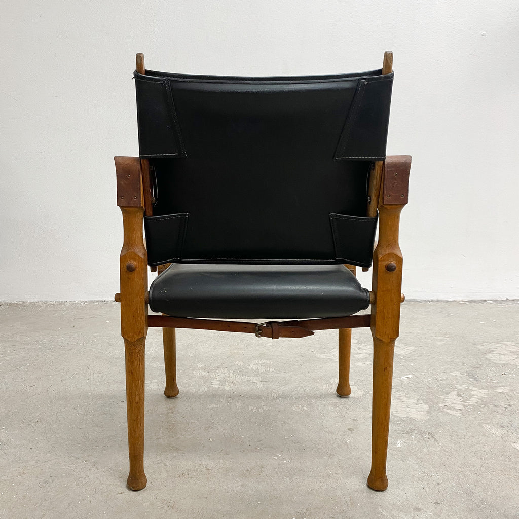 Designed by renowned furniture designer Michael Hirst, this chair drawn inspiration from classic safari aesthetics.