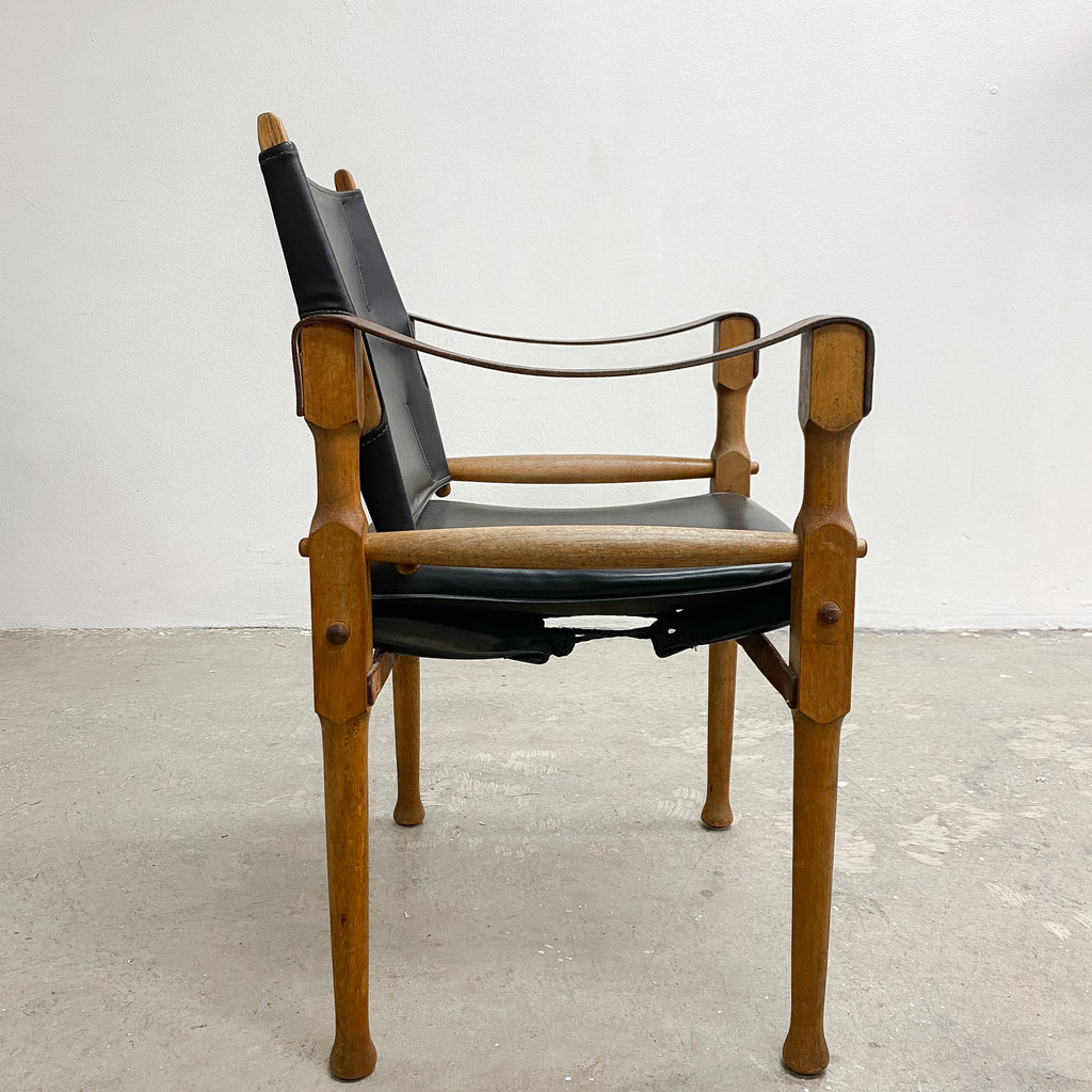 Designed by renowned furniture designer Michael Hirst, this chair drawn inspiration from classic safari aesthetics.