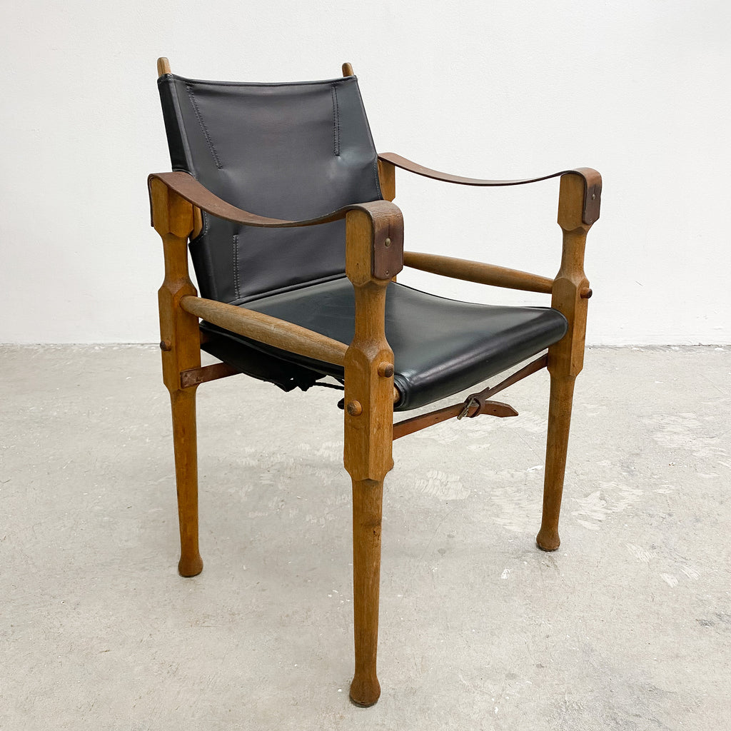 Designed by renowned furniture designer Michael Hirst, this chair drawn inspiration from classic safari aesthetics.