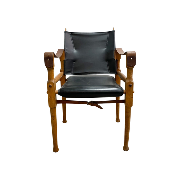 Designed by renowned furniture designer Michael Hirst, this chair drawn inspiration from classic safari aesthetics.