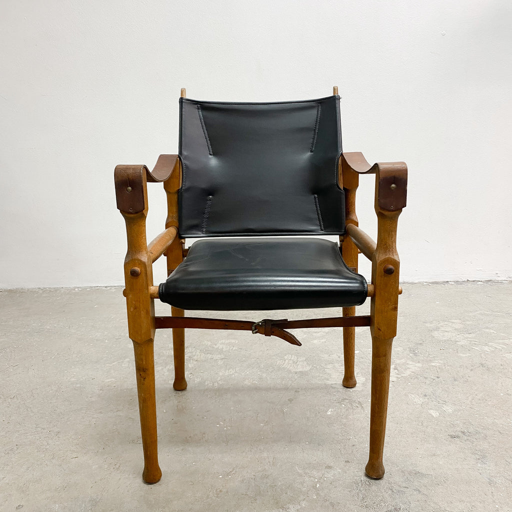 Designed by renowned furniture designer Michael Hirst, this chair drawn inspiration from classic safari aesthetics.