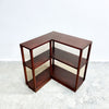 Wooden L-shaped bookshelf on a white background