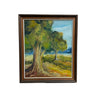 A framed landscape oil painting featuring two green trees in a grassy field under a blue sky, housed in a dark brown wooden frame and leaning against a white wall on a gray concrete floor.
