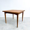 Wooden dining table on a white background