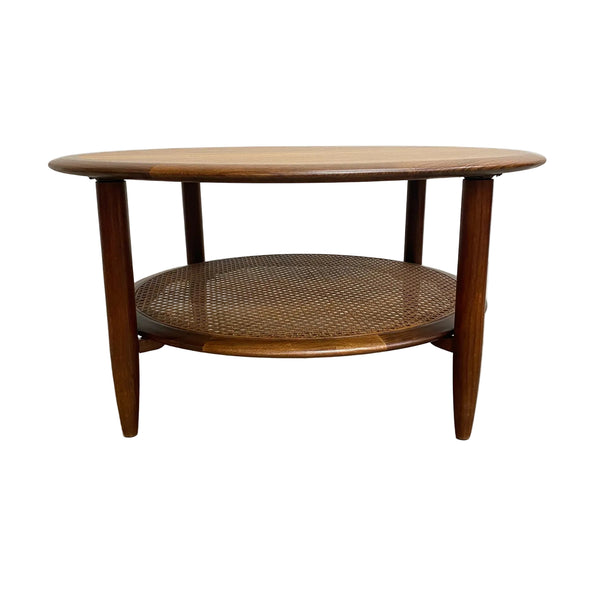 Stunning mid century TH Brown round coffee table. Made form Tasmanian Blackwood and featuring a rattan under shelf.