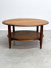 Stunning mid century TH Brown round coffee table. Made form Tasmanian Blackwood and featuring a rattan under shelf.