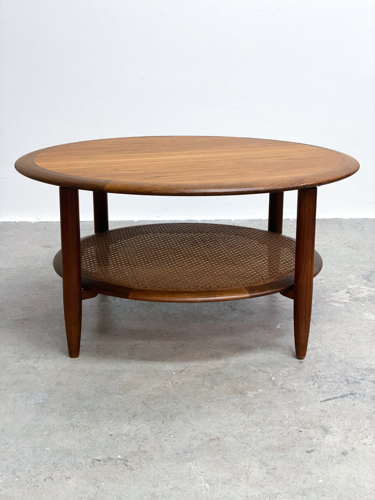 Stunning mid century TH Brown round coffee table. Made form Tasmanian Blackwood and featuring a rattan under shelf.