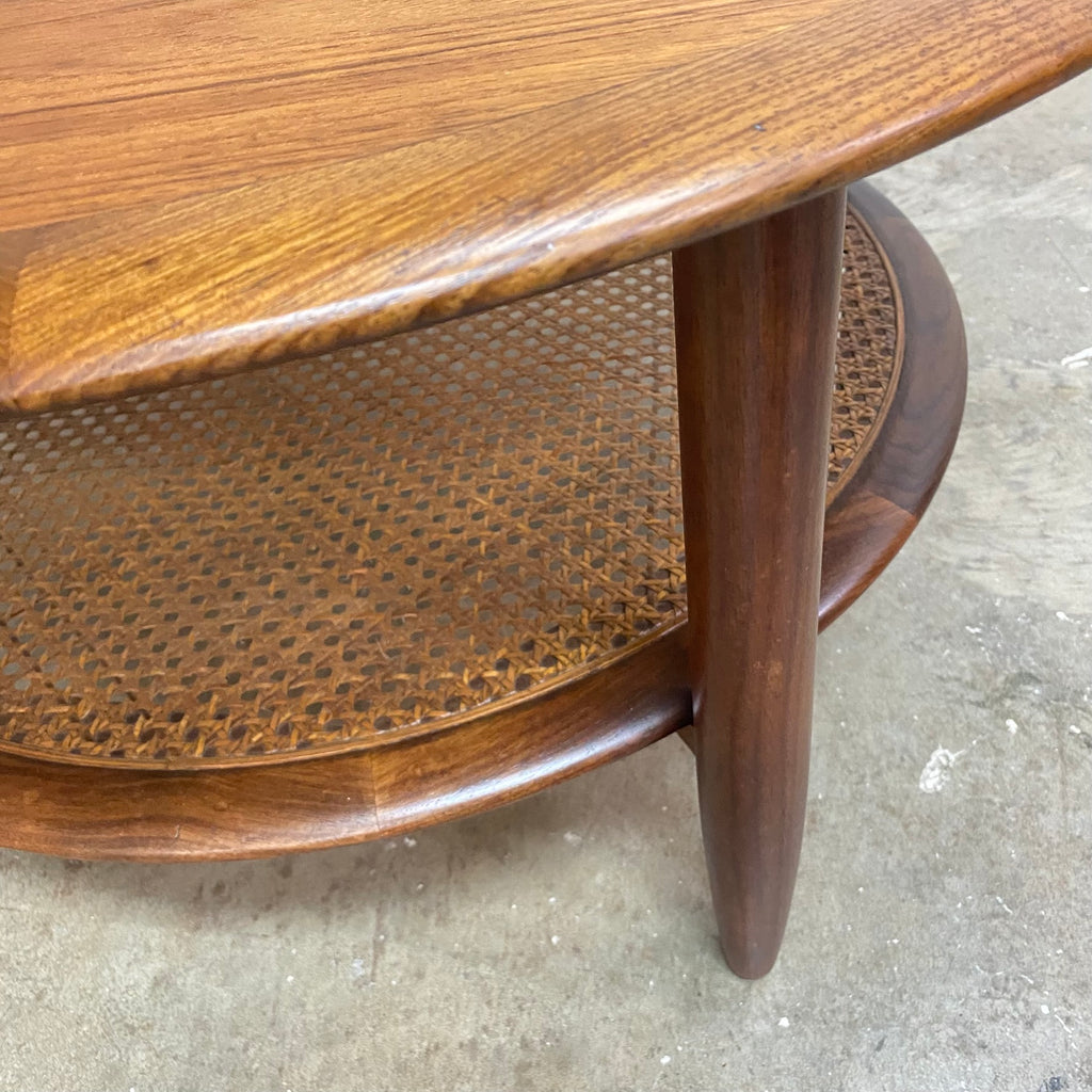 Stunning mid century TH Brown round coffee table. Made form Tasmanian Blackwood and featuring a rattan under shelf.