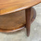 Stunning mid century TH Brown round coffee table. Made form Tasmanian Blackwood and featuring a rattan under shelf.