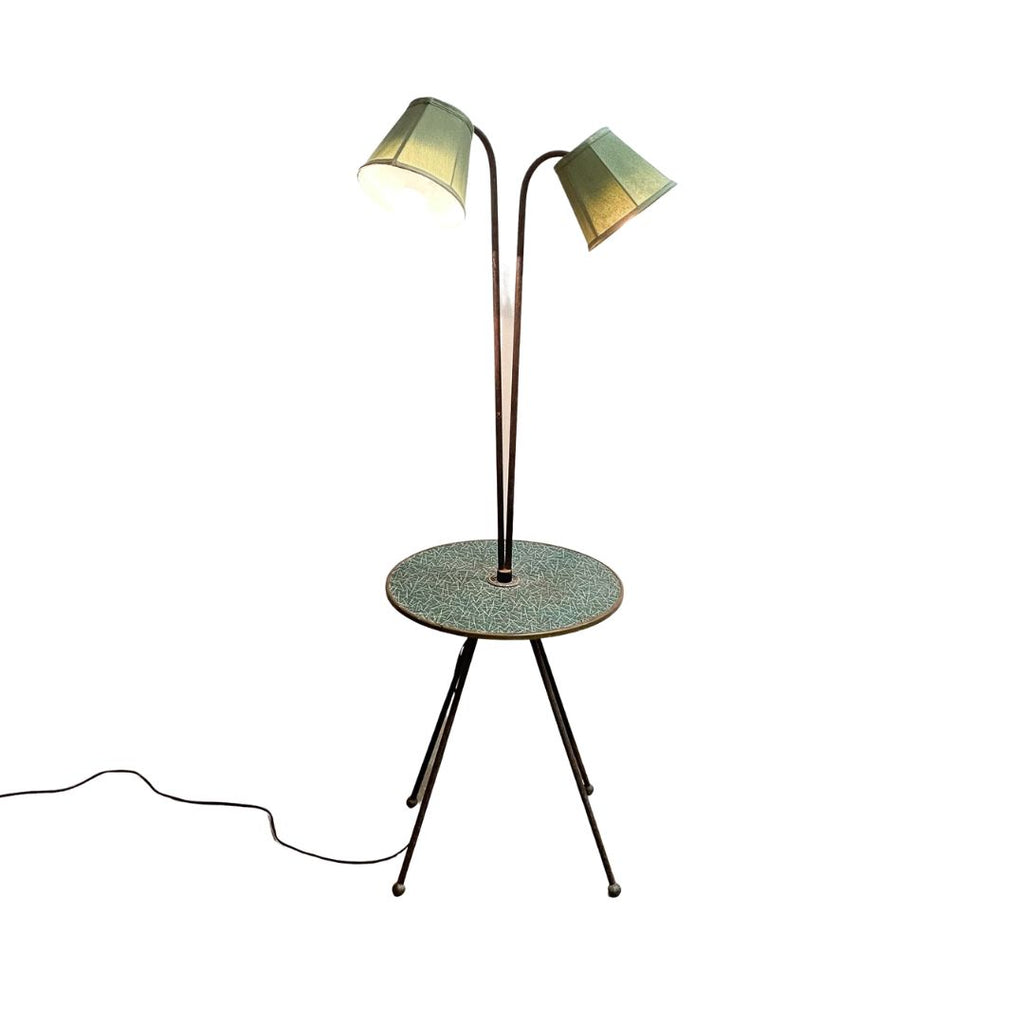 Floor lamp with a round table and two lampshades on a white background