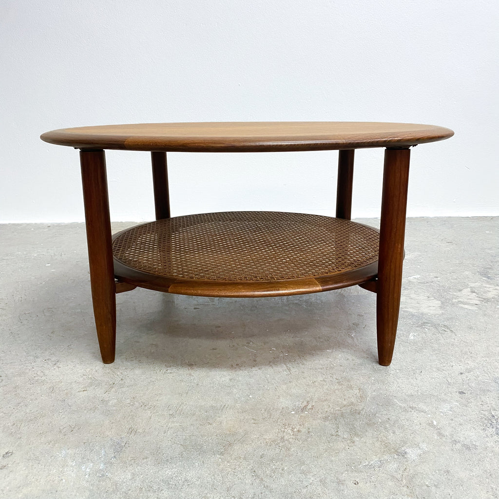 Stunning mid century TH Brown round coffee table. Made form Tasmanian Blackwood and featuring a rattan under shelf.