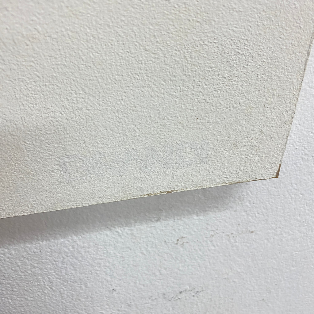 A close-up of a textured off-white or cream textured wall panel or wallpaper sample shown against a matching textured wall background.
