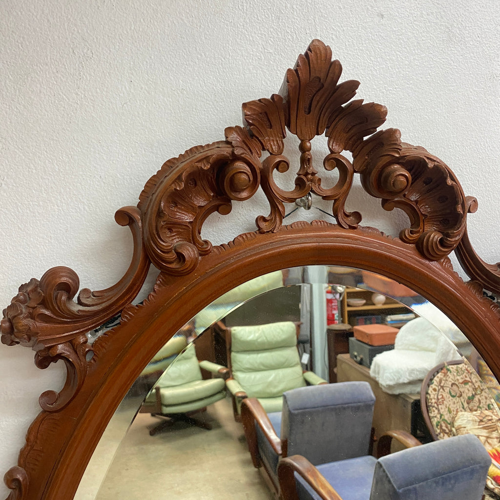 Ornately Carved 20th Century Oval Bevel Edge Mirror