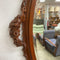 Ornately Carved 20th Century Oval Bevel Edge Mirror