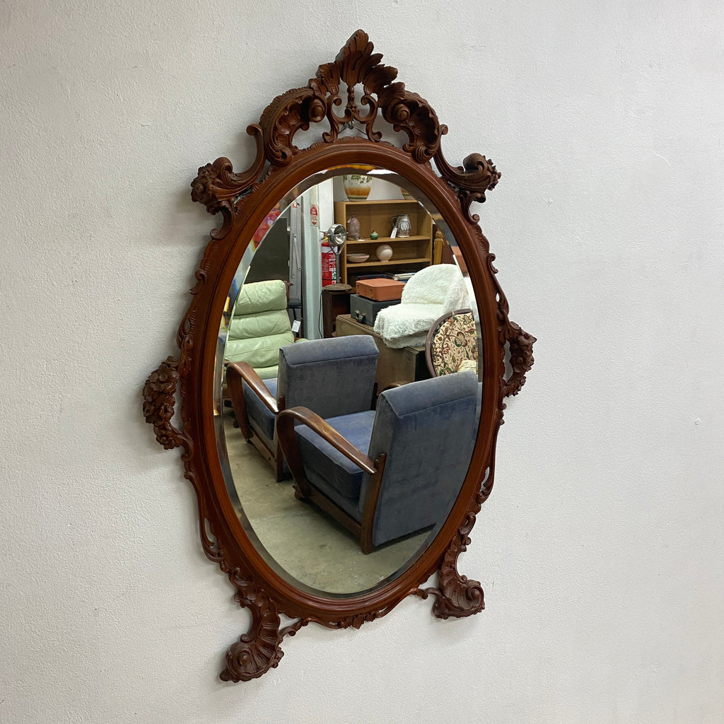 Ornately Carved 20th Century Oval Bevel Edge Mirror