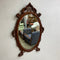 Ornately Carved 20th Century Oval Bevel Edge Mirror
