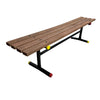 Wooden bench with black metal frame and colorful wheels on a concrete floor.