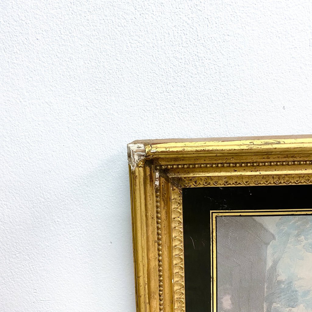 Gold picture frame corner on a white wall
