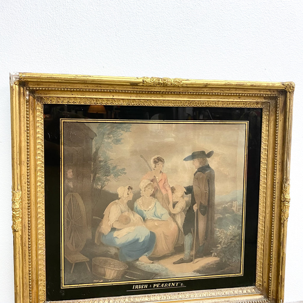 Framed artwork of a historical scene with people in a landscape