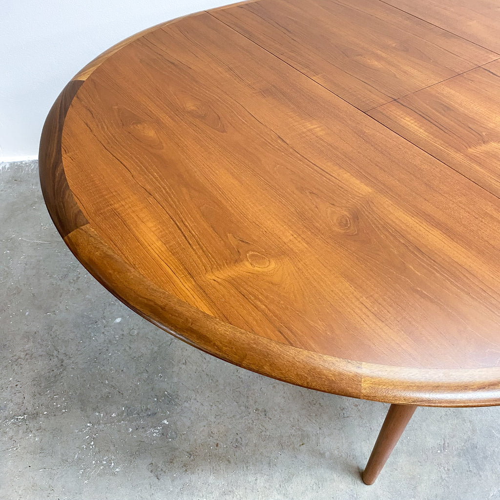 Wooden table with a smooth finish on a concrete floor