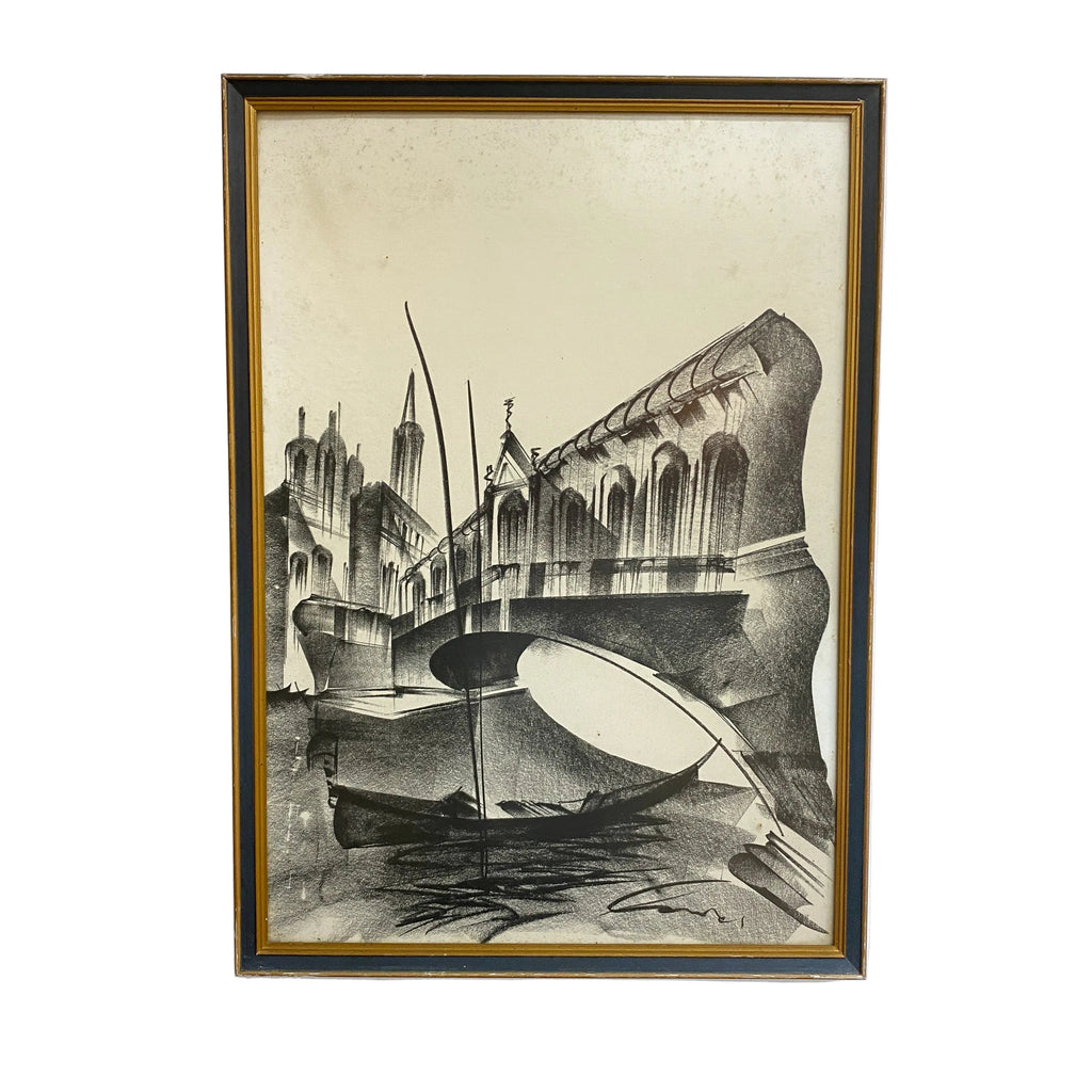 Framed artwork of a cityscape with a boat on water, on a white wall.