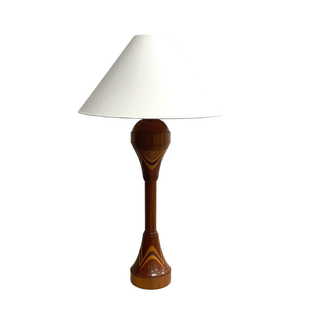 Wooden table lamp with a white shade on a white background
