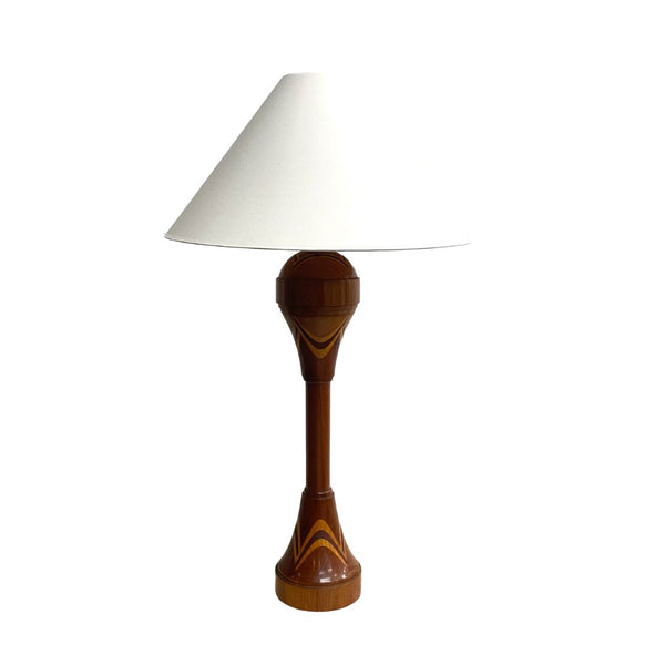 Wooden table lamp with a white shade on a white background