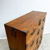 Wooden chest with metal handles on a light gray background