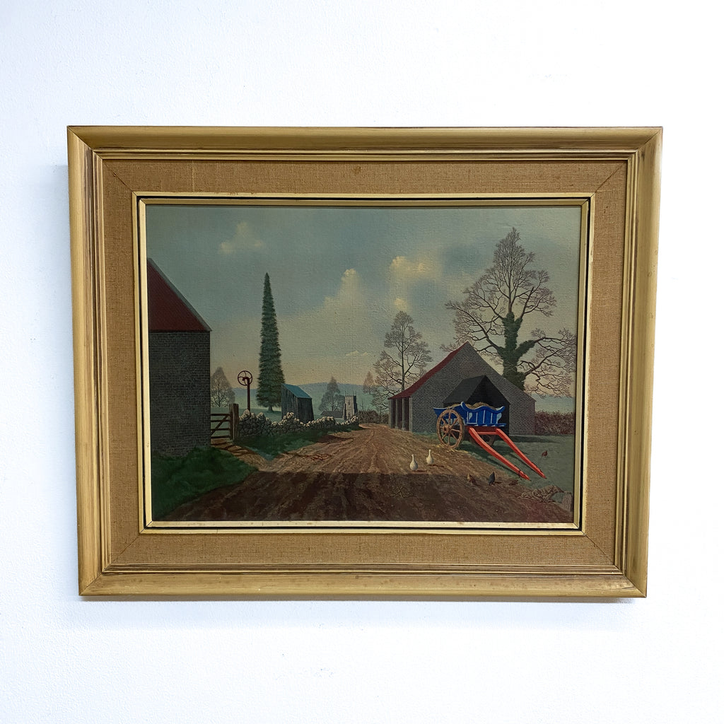 Framed painting of a rural landscape with a dirt road, buildings, and trees.