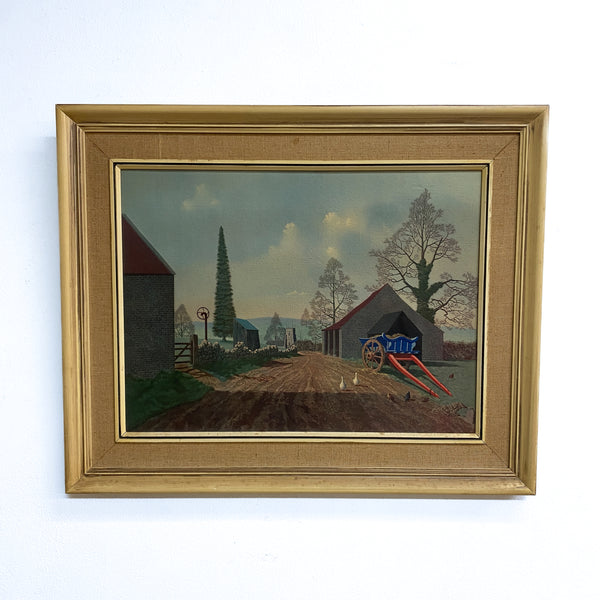 Framed painting of a rural landscape with a dirt road, buildings, and trees.