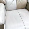 Close-up of a beige leather sofa corner