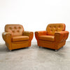 Pair of Orange Leather Rolled Armchairs