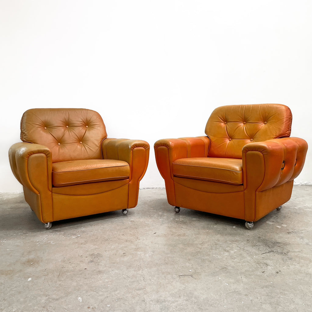 Pair of Orange Leather Rolled Armchairs