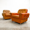 Pair of Orange Leather Rolled Armchairs