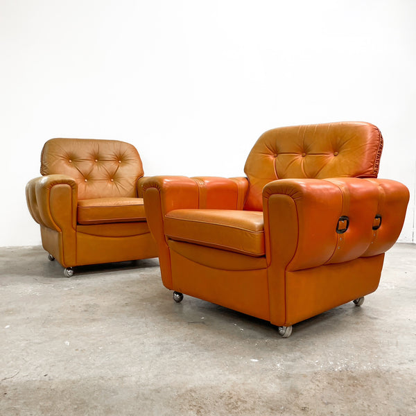 Pair of Orange Leather Rolled Armchairs